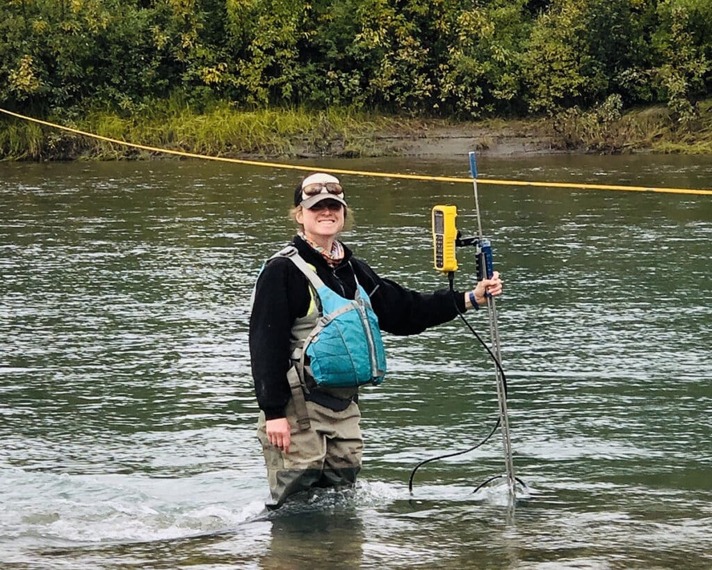 person in water with environmental equipment