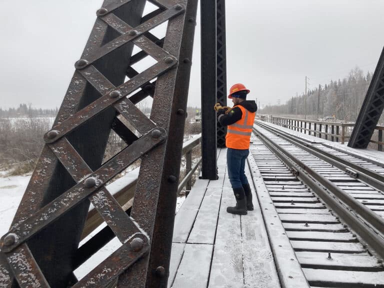 worker on train bridge