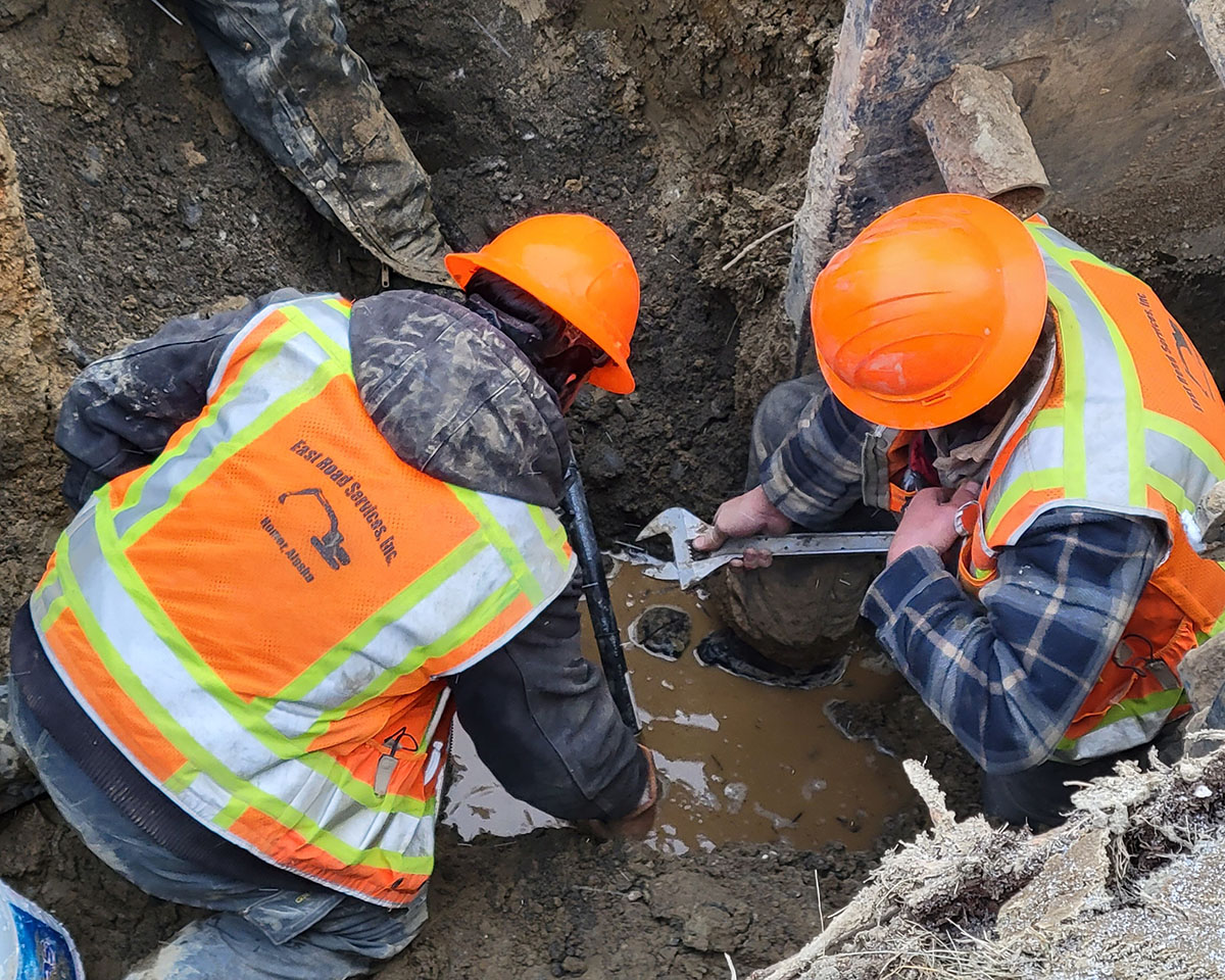 workers in a puddle